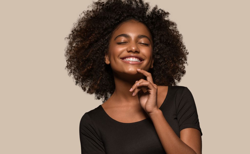 Woman Smiling Confidently After Tooth Filling in Spring Lake, MI